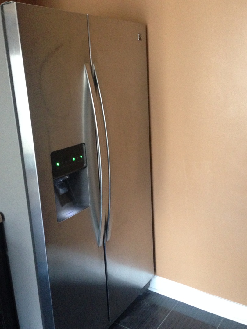 157 Peter Court, Unit D Bartlett, IL 60103 - Photo 7 of 16 an empty room with wooden floor