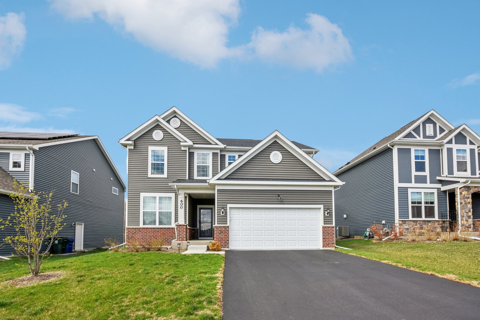 front view of a house with a yard