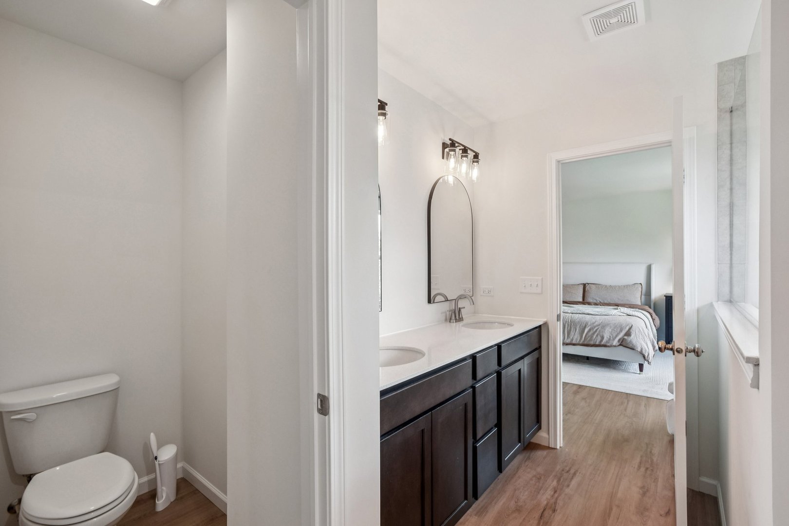 600 Alpine Drive Algonquin, IL 60102 - Photo 24 of 40 a en suite bathroom with a granite countertop sink and a mirror