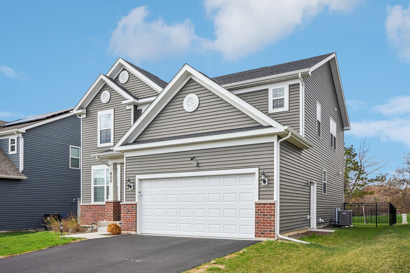 600 Alpine Drive Algonquin, IL 60102 - Photo 3 of 40 a front view of a house with a garden