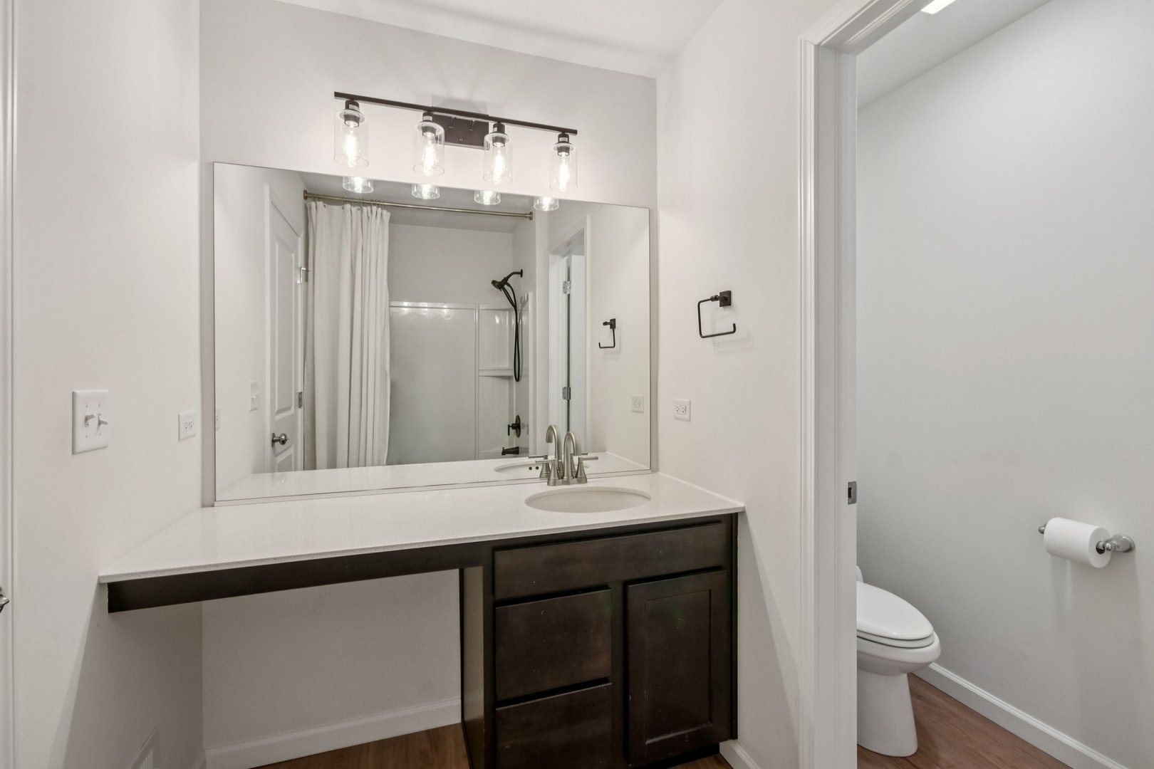 600 Alpine Drive Algonquin, IL 60102 - Photo 34 of 40 a bathroom with a sink a toilet a large mirror and shower