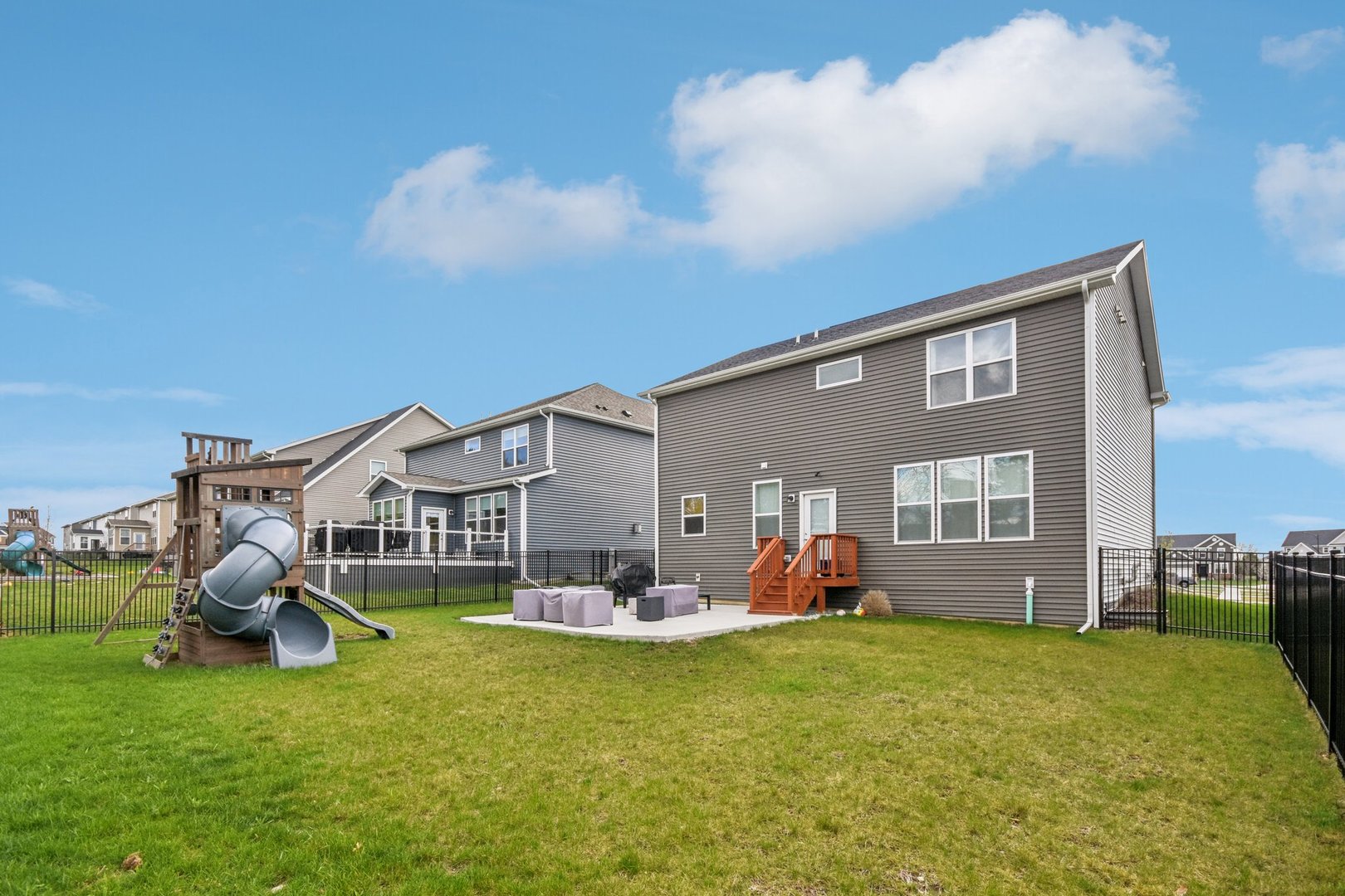 600 Alpine Drive Algonquin, IL 60102 - Photo 38 of 40 a childrens park with lots of swings and slides