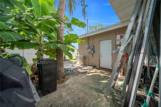a backyard of a house with outdoor seating