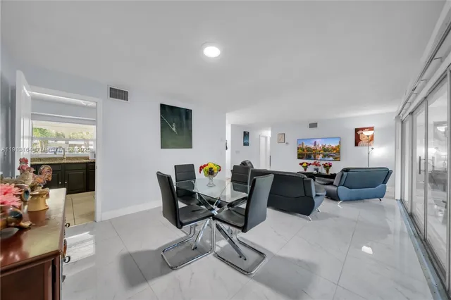 a view of a livingroom with workspace and a couch