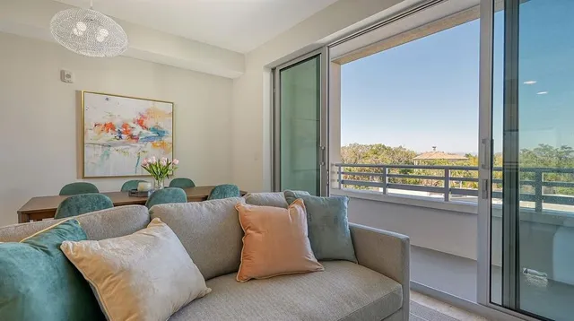 a view of city from balcony with outdoor seating