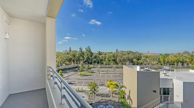 a kitchen with a sink white cabinets and appliances