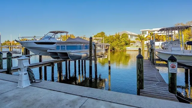 a kitchen with stainless steel appliances granite countertop a refrigerator sink and stove