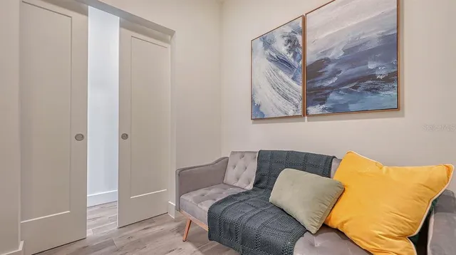a living room with furniture and a large window