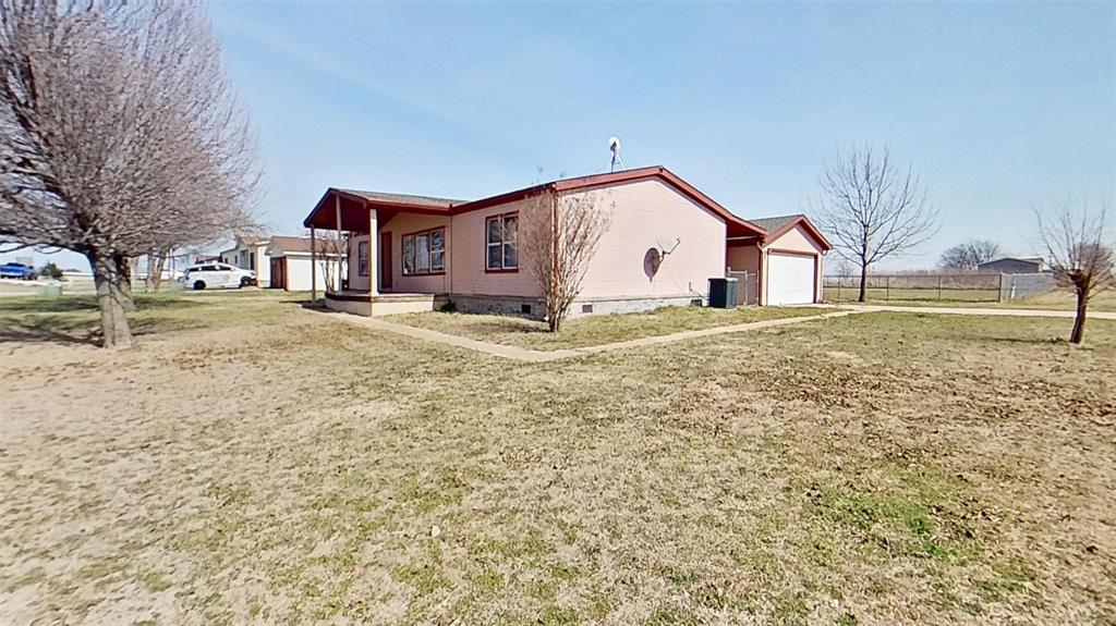 1106 Spring Flower Drive Krum, TX 76249 - Photo 3 of 22 a view of big yard with a small yard and a large tree