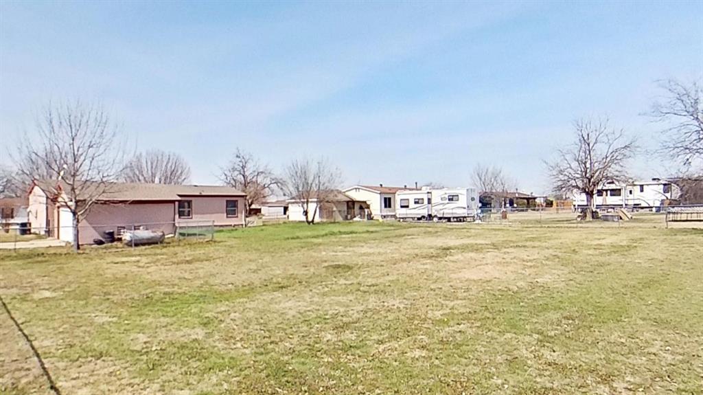 1106 Spring Flower Drive Krum, TX 76249 - Photo 4 of 22 a view of an ocean with residential houses