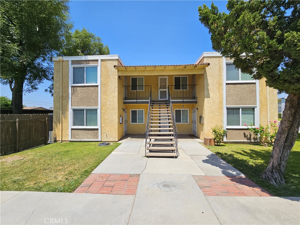 10976 Rincon Street Loma Linda, CA 92354 - Photo 1 of 12 front view of a house with a yard