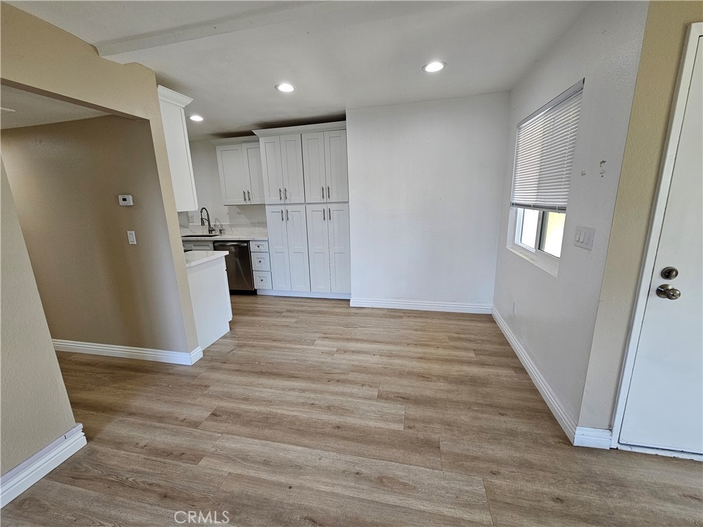 10976 Rincon Street Loma Linda, CA 92354 - Photo 4 of 12 a view of a kitchen with a sink and a refrigerator