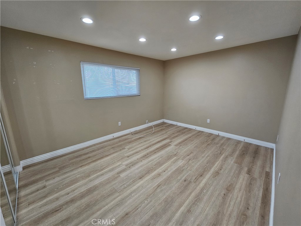 10976 Rincon Street Loma Linda, CA 92354 - Photo 9 of 12 a view of room with wooden floor
