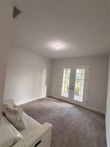 a bedroom with a bed and cabinet