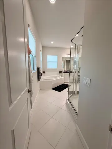 a living room with furniture and flowers