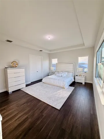 a bathroom with a sink mirror and toilet