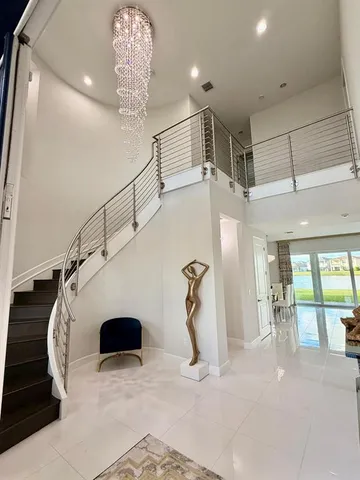 a view of a room with wooden floor and a window