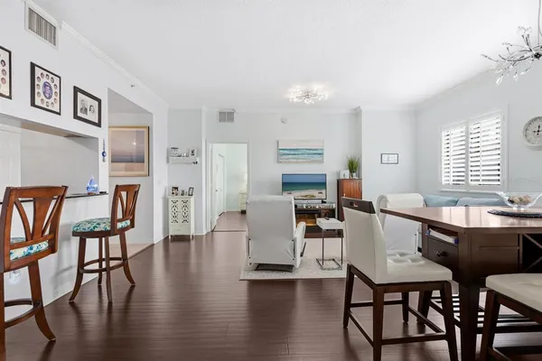 a view of a dining room with furniture and wooden floor