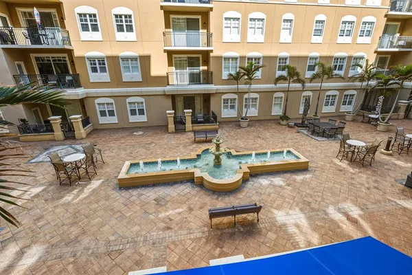 a view of a swimming pool with outdoor seating