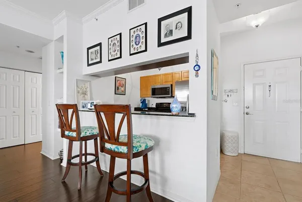 a dining room with furniture and wooden floor