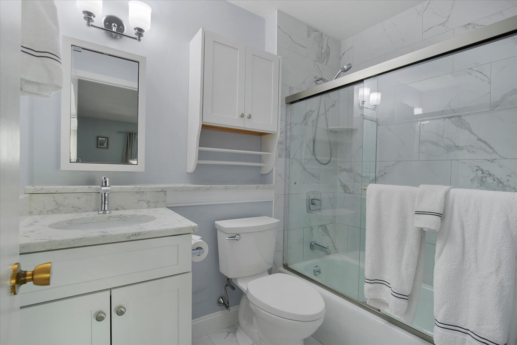800 Bearses Way, Unit 1EB Hyannis, MA 02601 - Photo 23 of 37 a bathroom with a sink toilet vanity and shower