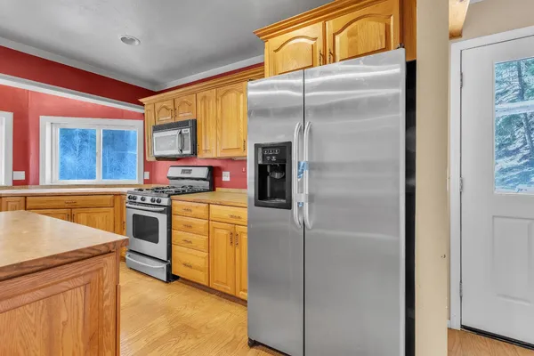 a kitchen with sink cabinets and window