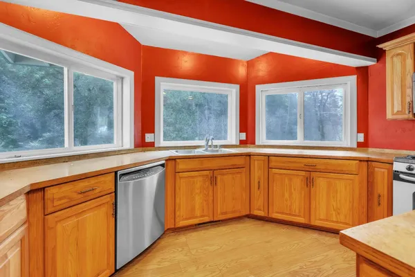 a kitchen with stainless steel appliances granite countertop cabinets and a granite counter tops