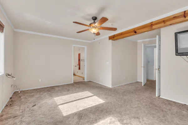 a view of livingroom with hardwood floor and ceiling fan