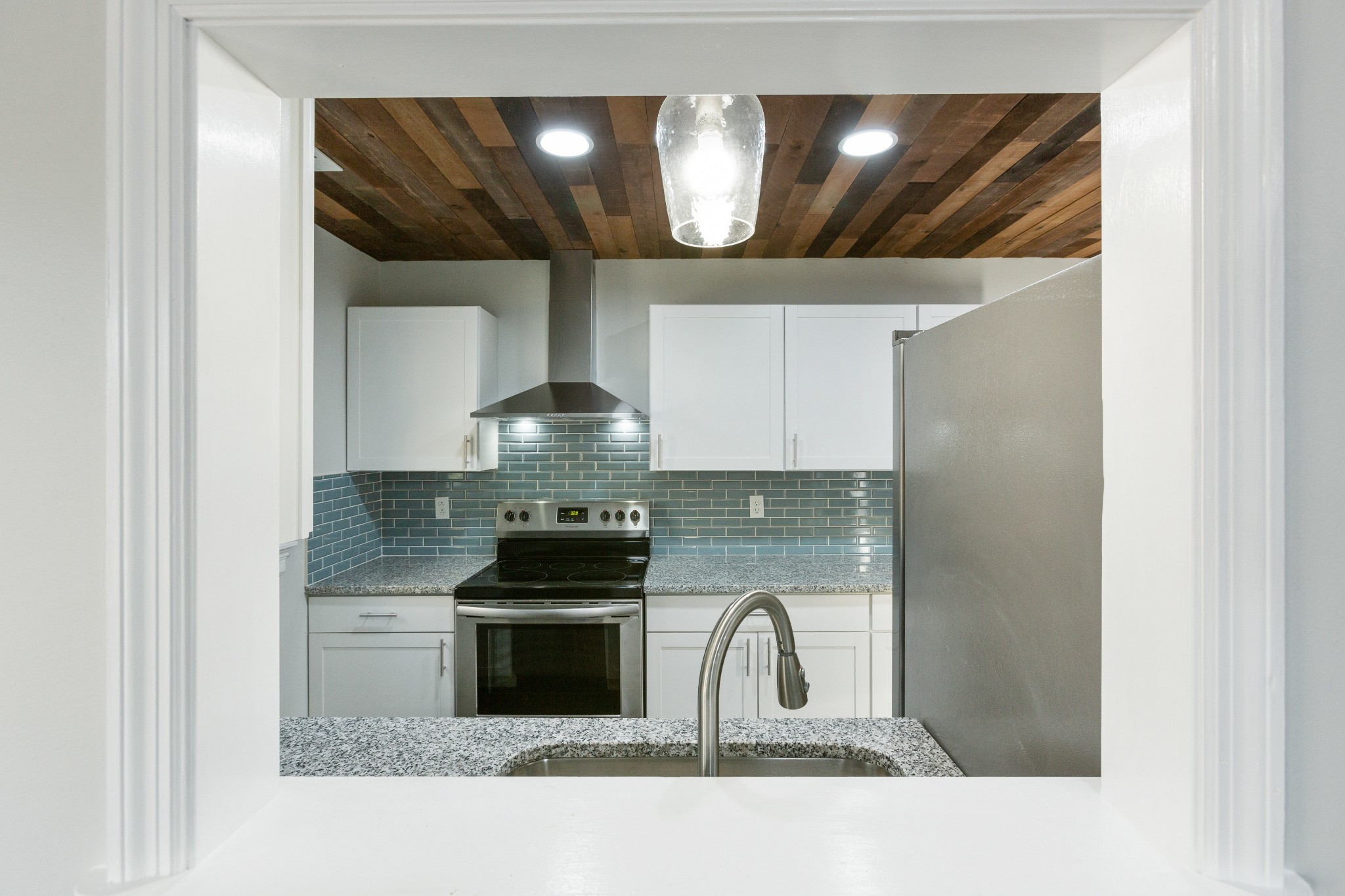 6169 Highway 76 Springfield, TN 37172 - Photo 14 of 34 a kitchen with stainless steel appliances a stove and a microwave