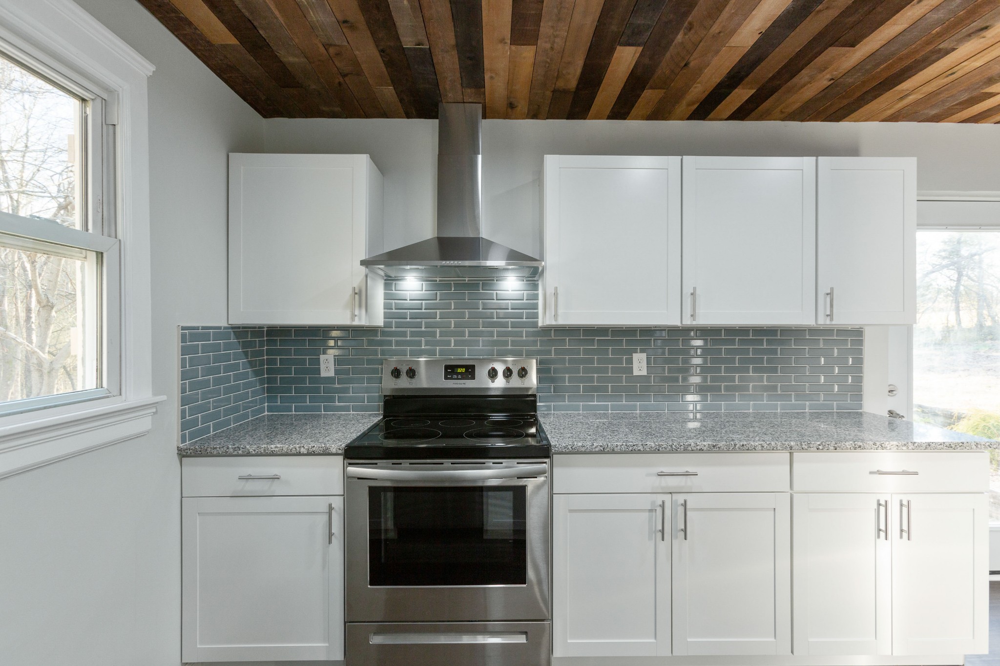 6169 Highway 76 Springfield, TN 37172 - Photo 15 of 34 a kitchen with stainless steel appliances granite countertop white cabinets and a stove