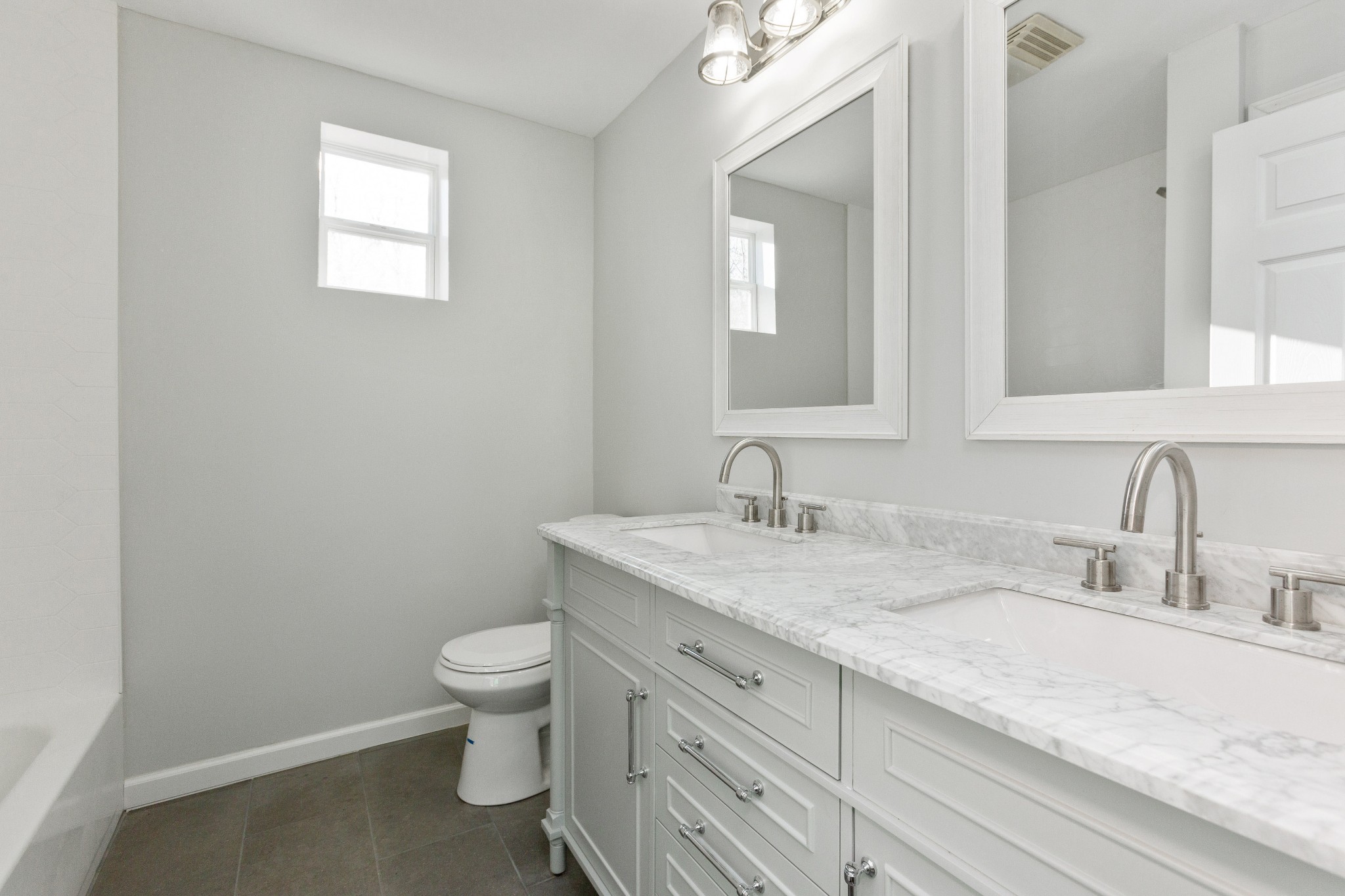 6169 Highway 76 Springfield, TN 37172 - Photo 16 of 34 a bathroom with a granite countertop sink a toilet and a mirror