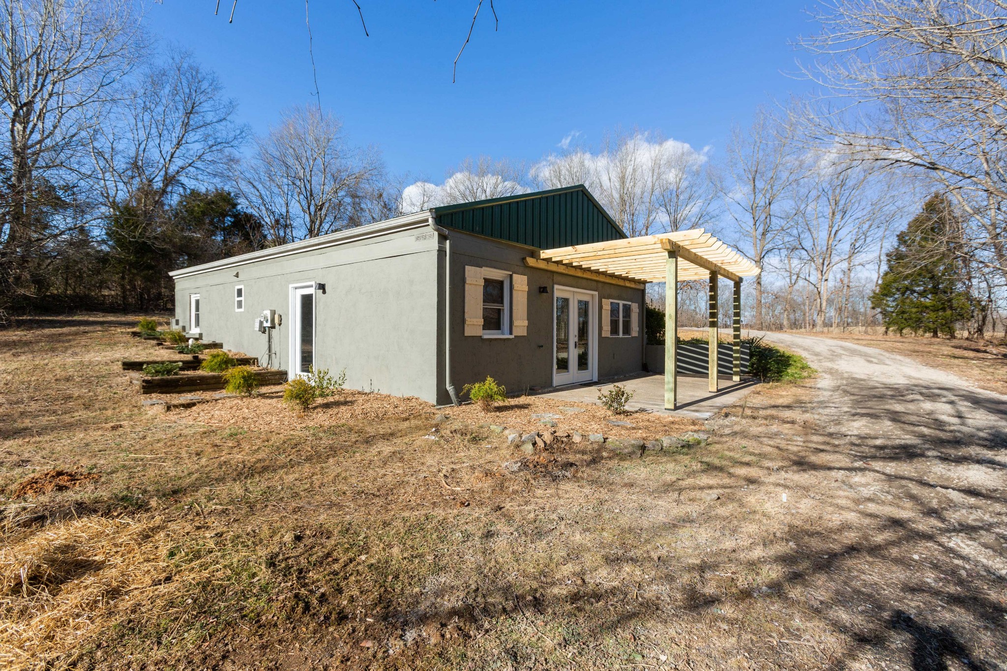 6169 Highway 76 Springfield, TN 37172 - Photo 3 of 34 a view of a white house with a yard and sitting area