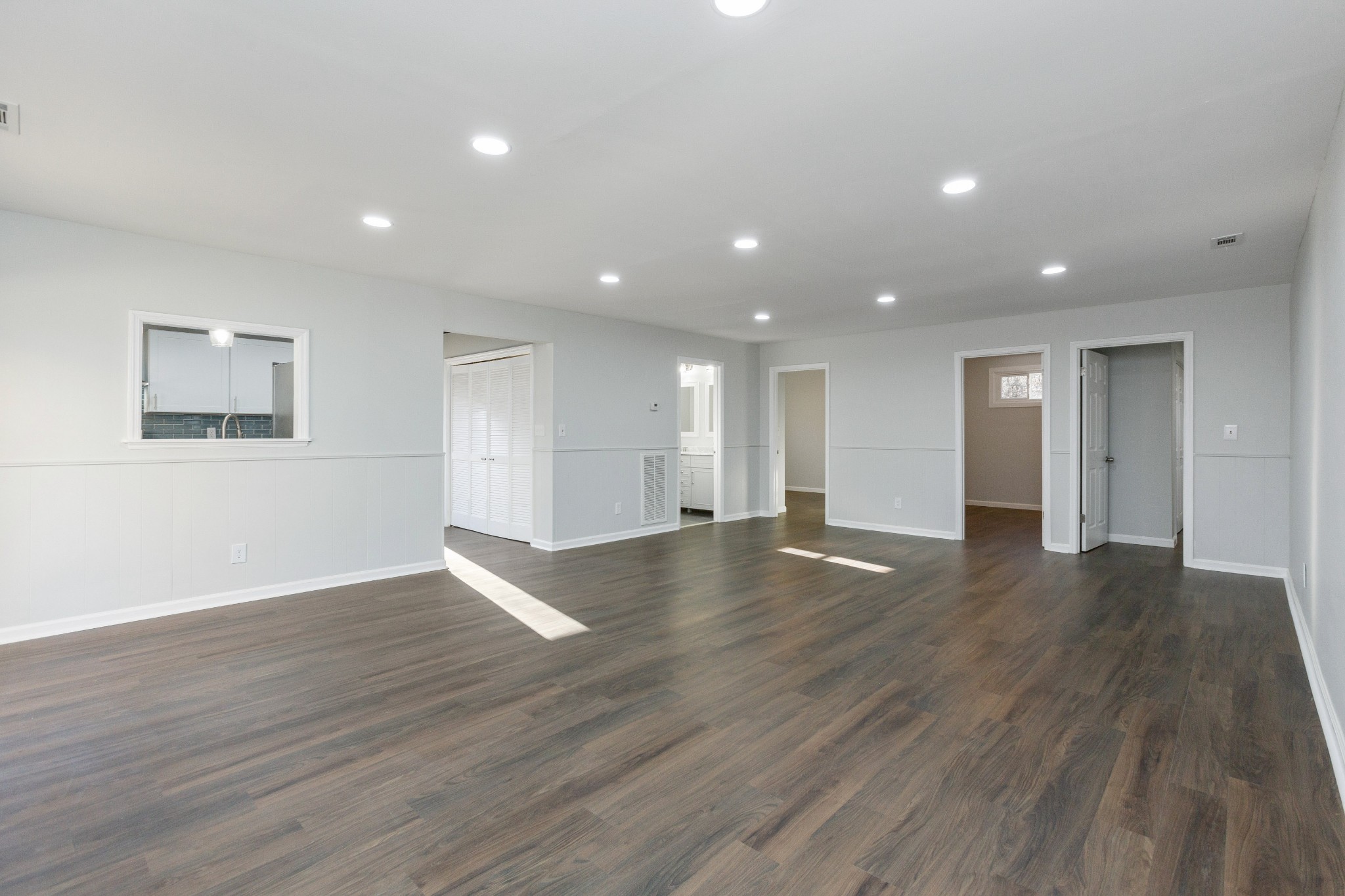 6169 Highway 76 Springfield, TN 37172 - Photo 6 of 34 a view of an empty room with wooden floor and windows