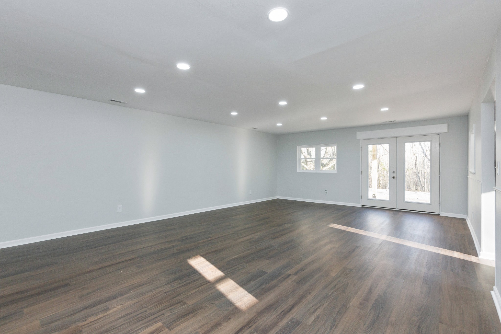 6169 Highway 76 Springfield, TN 37172 - Photo 8 of 34 a view of an empty room with wooden floor and window