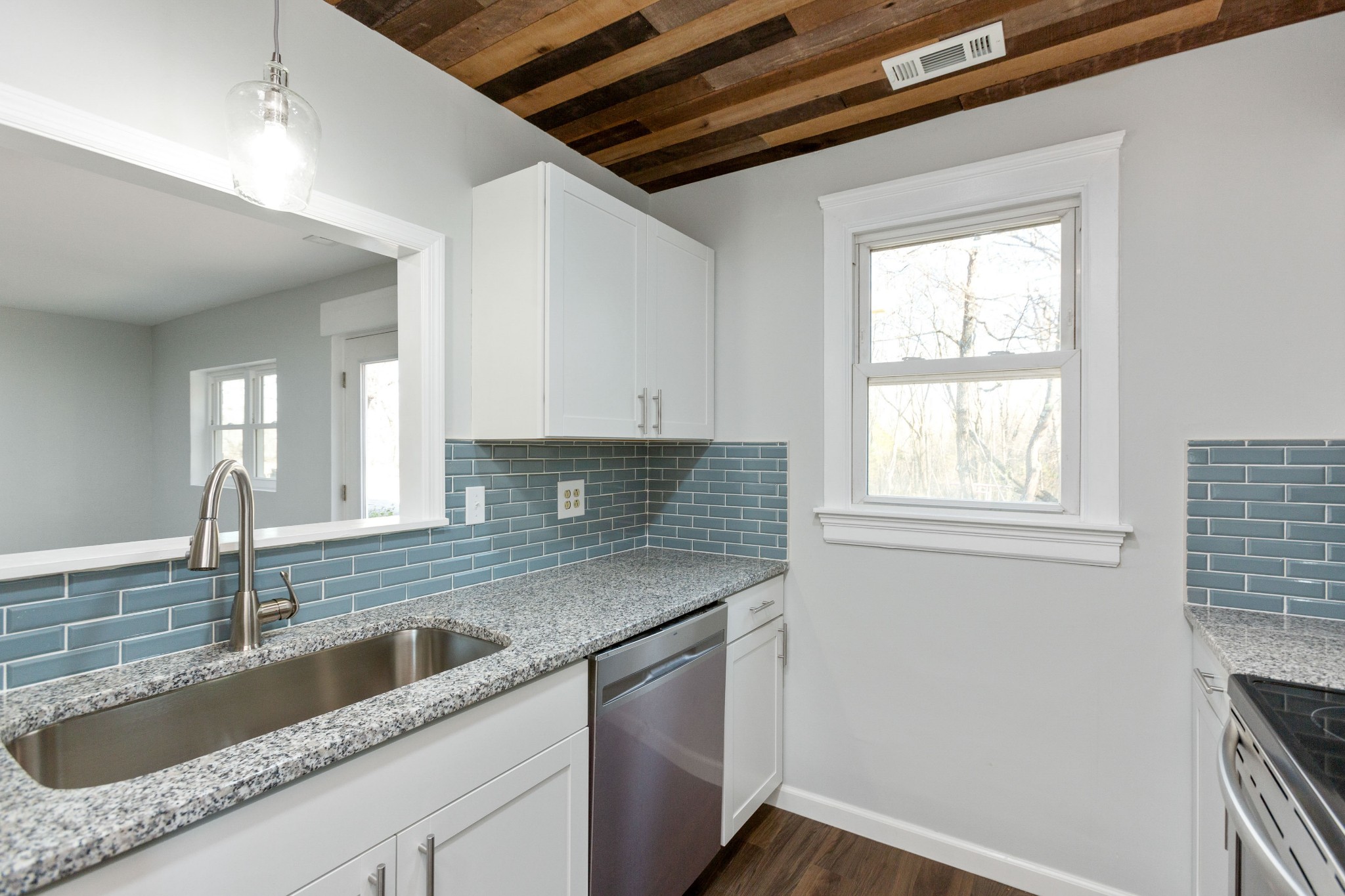 6169 Highway 76 Springfield, TN 37172 - Photo 9 of 34 a kitchen with a sink window and cabinets