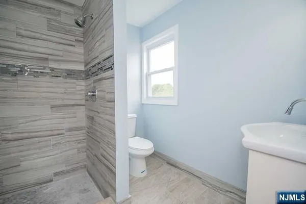 a bathroom with a toilet and a sink