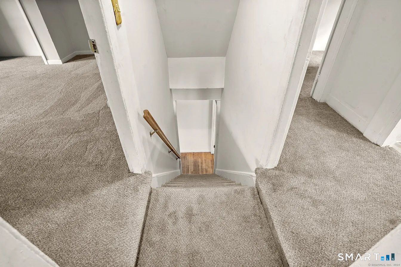 25 Pleasant Street Ansonia, CT 06401 - Photo 13 of 16 a view of a hallway with staircase