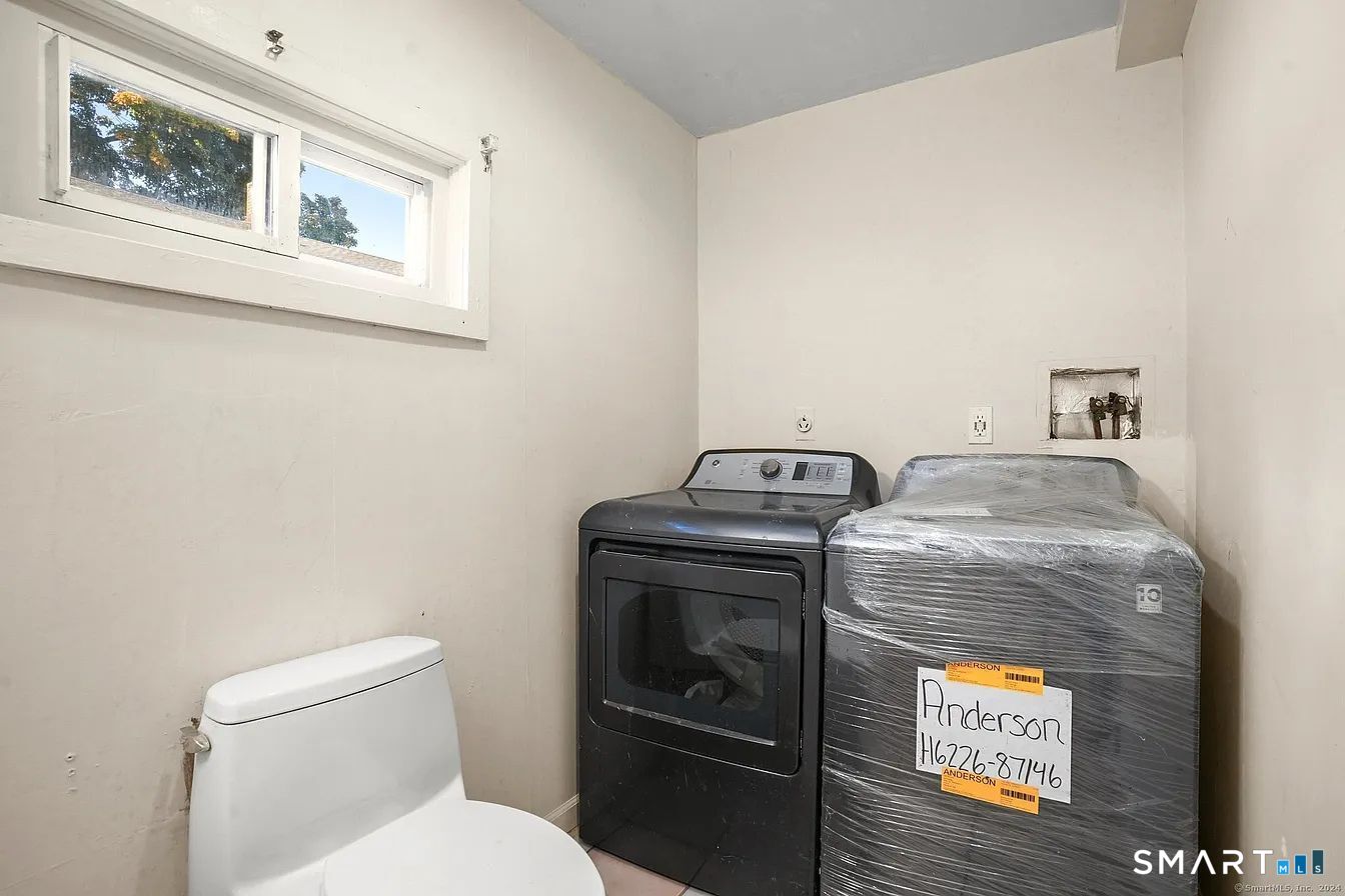25 Pleasant Street Ansonia, CT 06401 - Photo 16 of 16 a utility room with dryer and washer