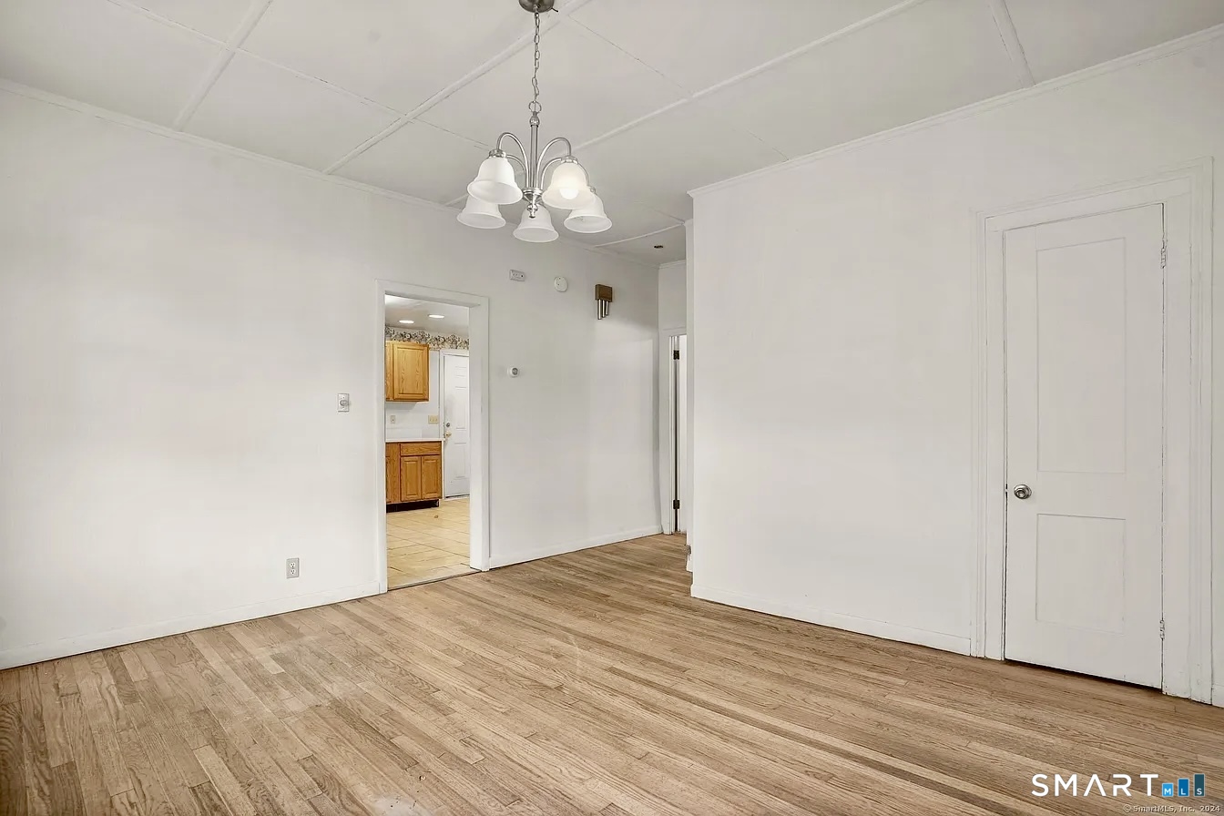 25 Pleasant Street Ansonia, CT 06401 - Photo 5 of 16 a view of a livingroom with a chandelier fan