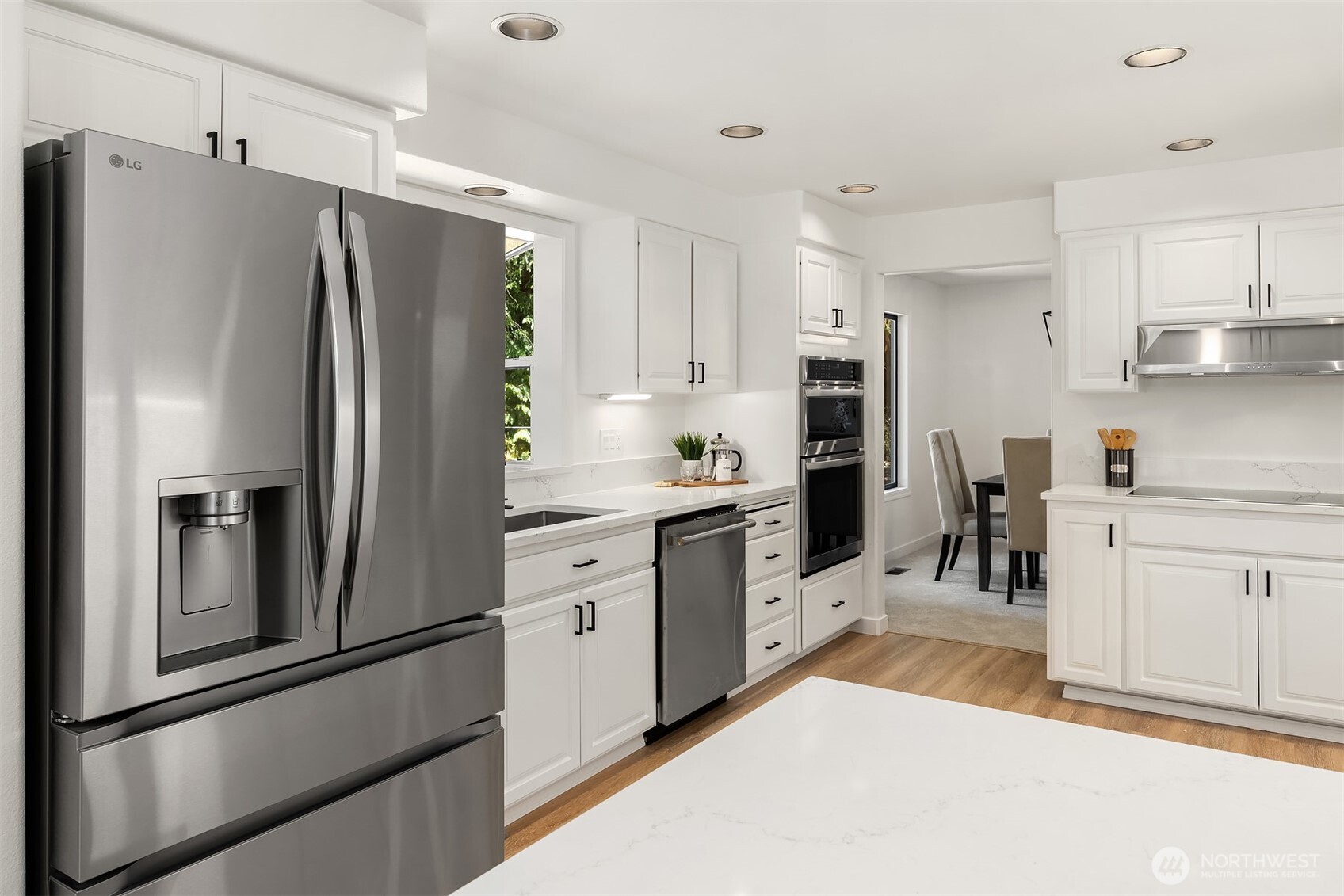 22918 49th Avenue Southeast Bothell, WA 98021 - Photo 12 of 38 a kitchen with stainless steel appliances a refrigerator sink and cabinets
