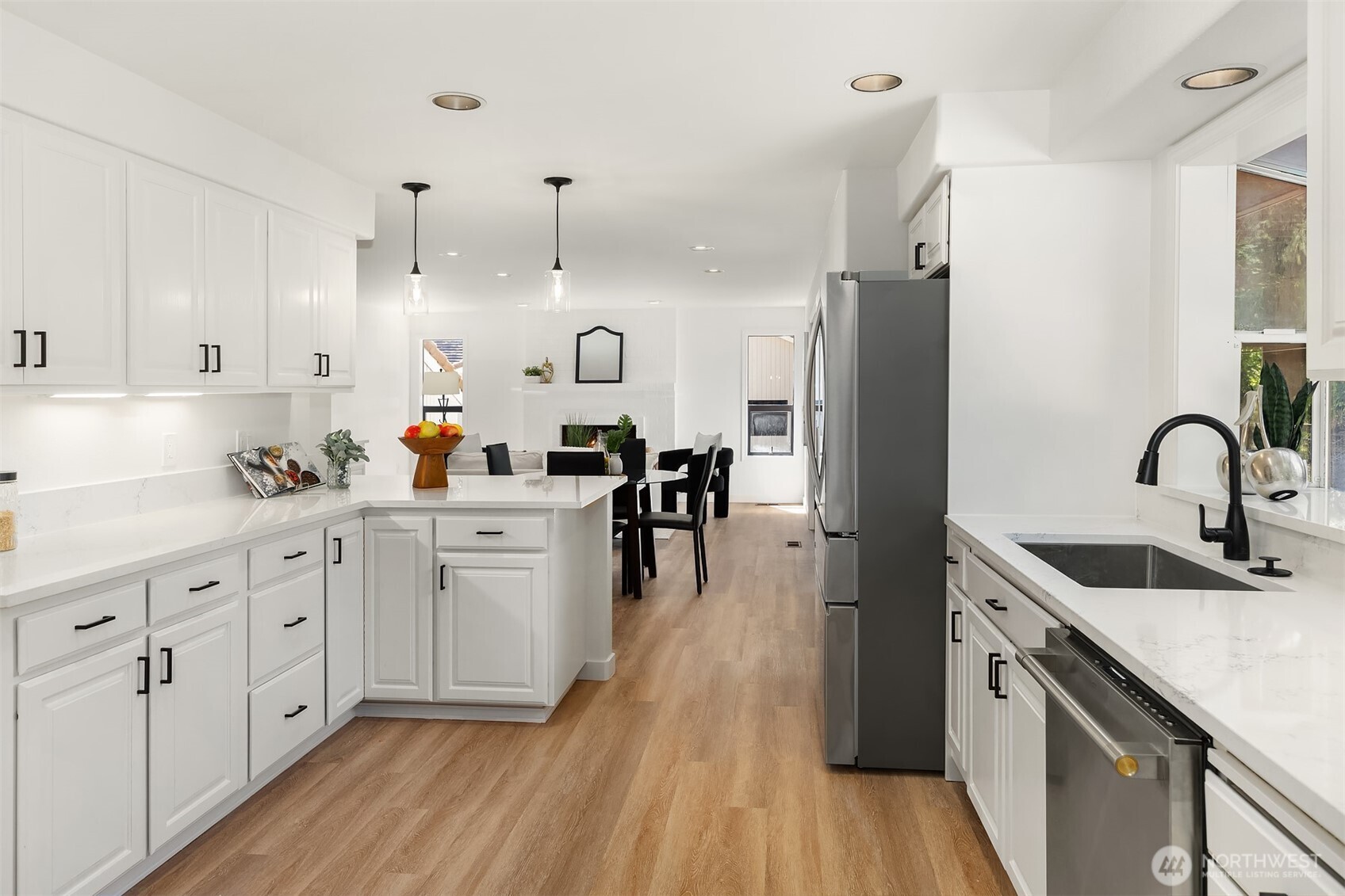 22918 49th Avenue Southeast Bothell, WA 98021 - Photo 13 of 38 a kitchen with white cabinets and stainless steel appliances