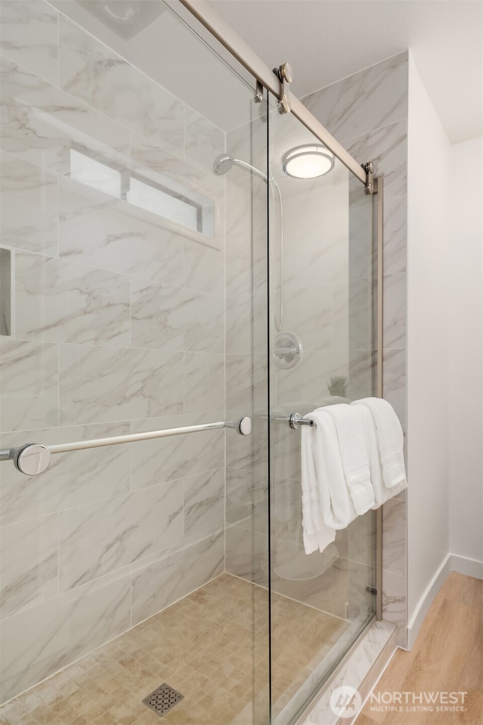 22918 49th Avenue Southeast Bothell, WA 98021 - Photo 27 of 38 a bathroom with a shower and a glass door