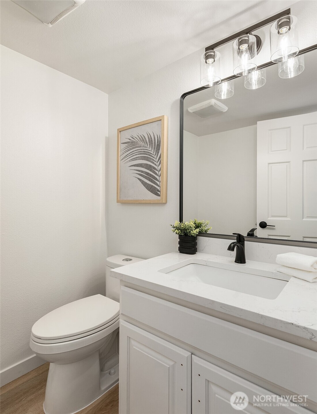 22918 49th Avenue Southeast Bothell, WA 98021 - Photo 6 of 38 a bathroom with a sink a toilet and mirror
