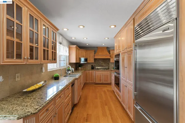 a kitchen with lots of counter top space and a sink