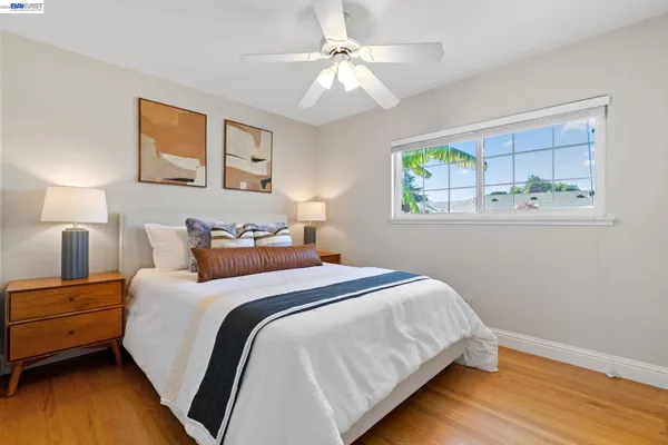 a bedroom with a bed and window