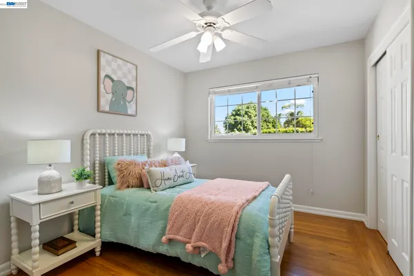 a bedroom with furniture and a chair