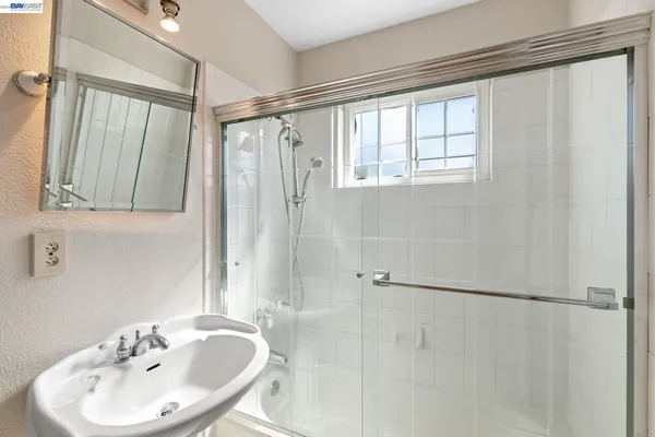 a utility room with sink dryer and washer