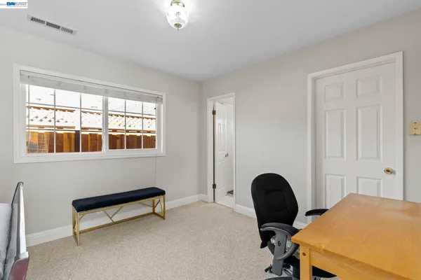 a view of a house with a yard patio and fire pit