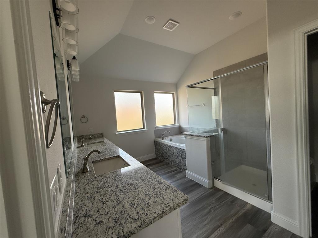 502 Second Street Venus, TX 76084 - Photo 5 of 5 a bathroom with a granite countertop sink a mirror and shower