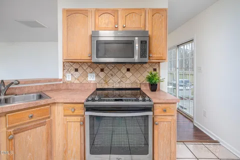 a kitchen with a stove and a sink